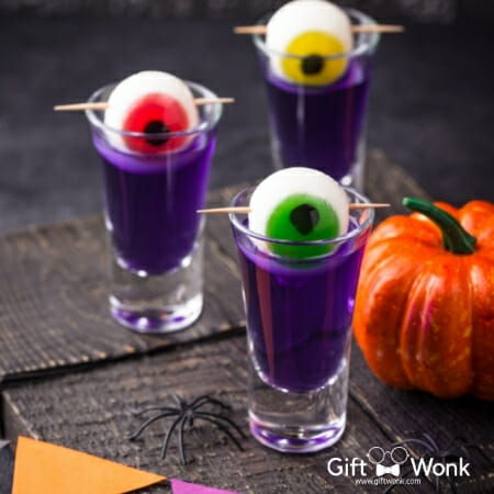 Halloween gift bag - shot glasses filled with purple cocktail 