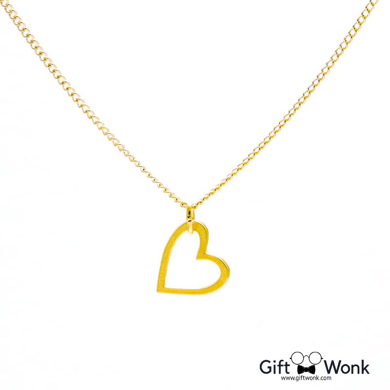 A picture of a gold heart pendant necklace