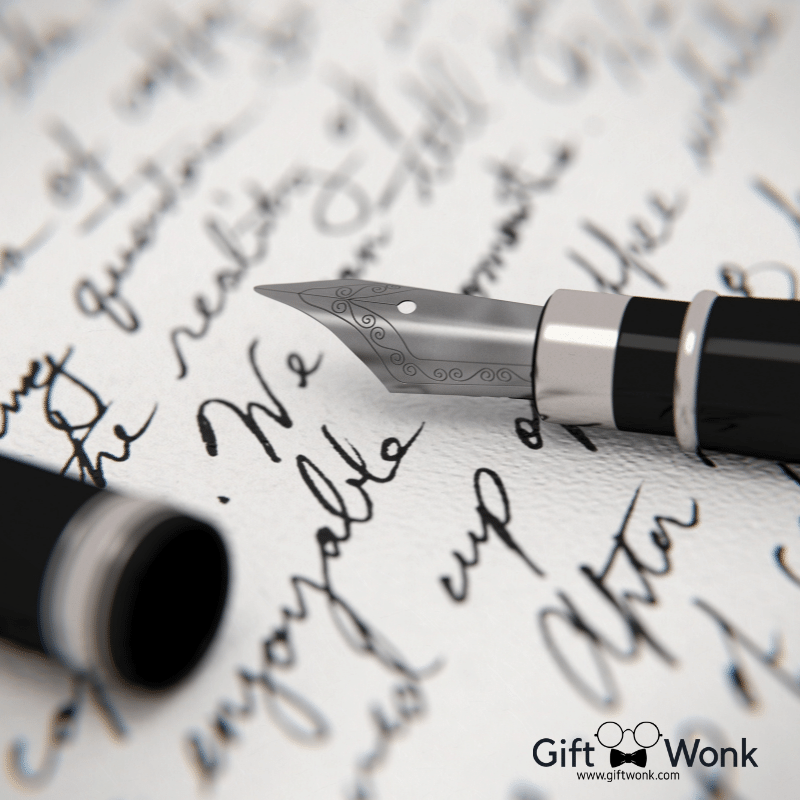 A picture of a handwritten letter with a fountain pen on top